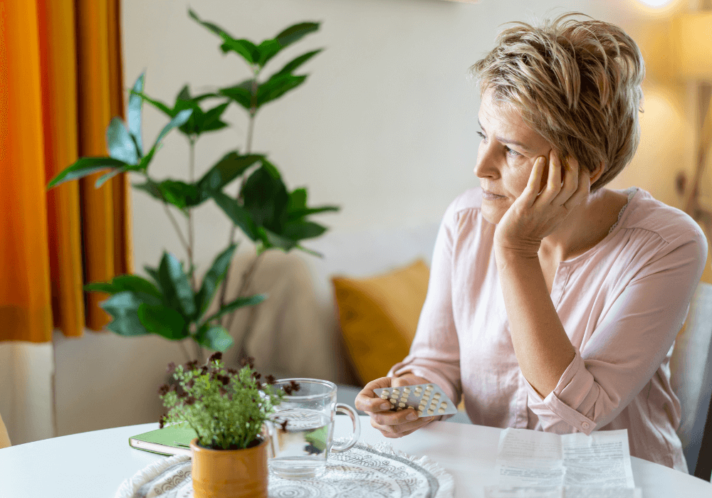 Woman with pills during menopause treatment