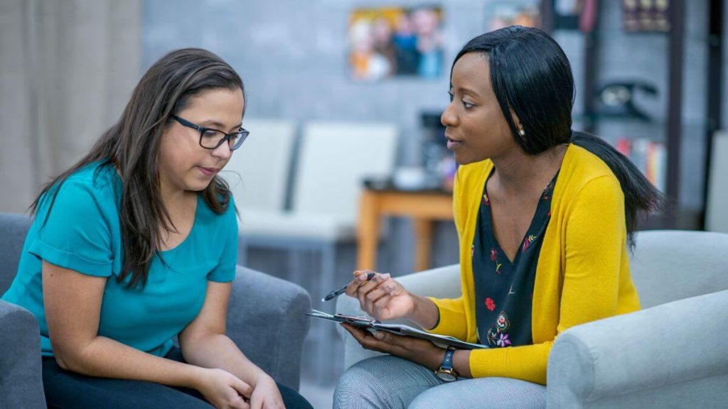 Women discussing weight loss hormone therapy